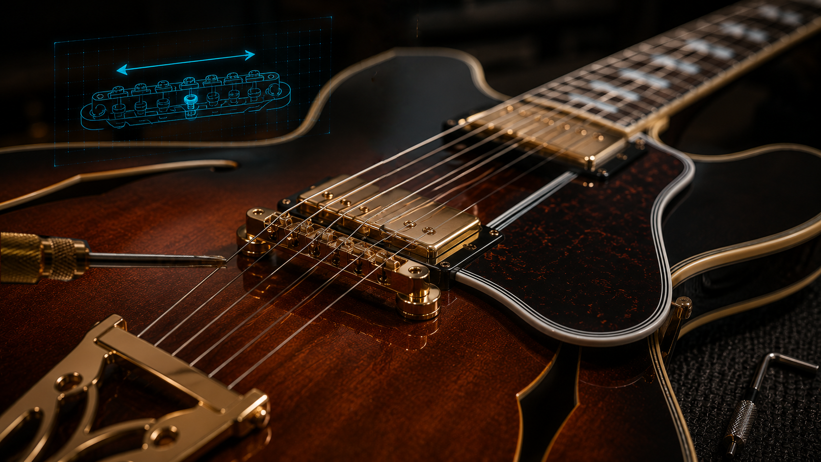 Close-up of guitar bridge intonation adjustment screws with a screwdriver positioned for adjustment